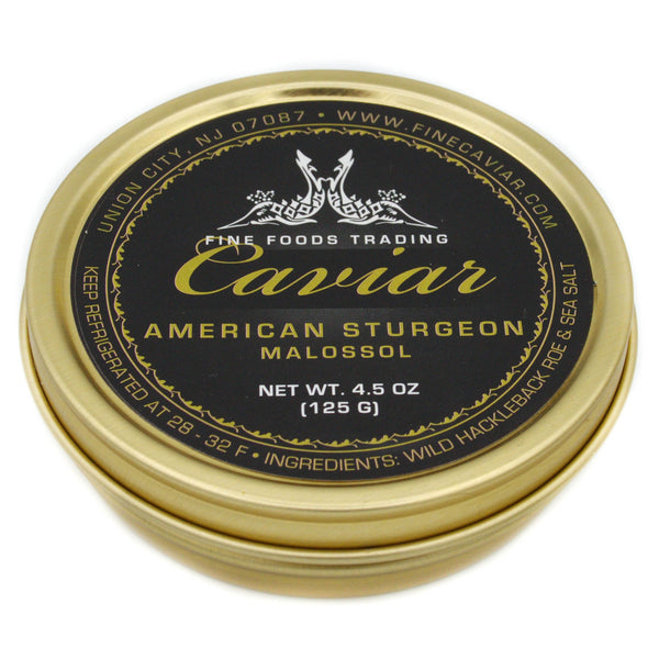 A tin can of American Sturgeon Caviar Container with black and gold label, net weight 4.5 oz. (125 g). View from side.