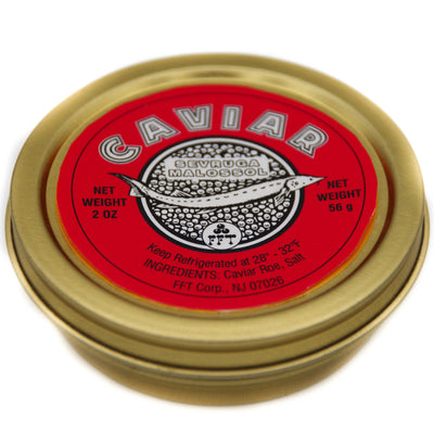 A closed gold caviar tin viewed at an angle, with a red label reading 'Caviar Sevruga Malossol' and a sturgeon illustration, showing net weight 2 oz / 56 g, on a white background.